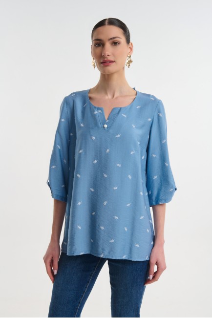 Blouse with decorative button