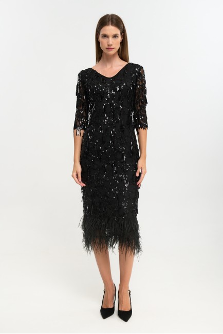 Dress with feathers at the hem