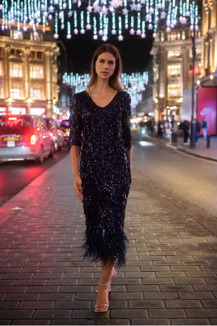 Dress with feathers at the hem